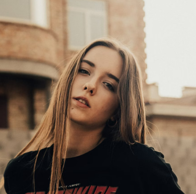 Woman with long blonde hair posing