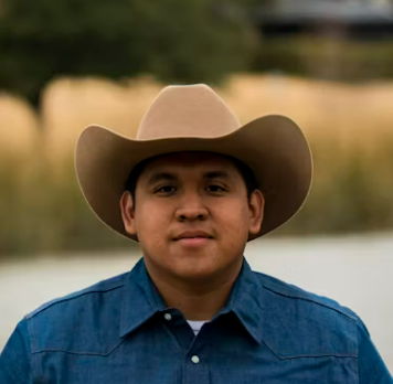 Man in cowboy hat smiling